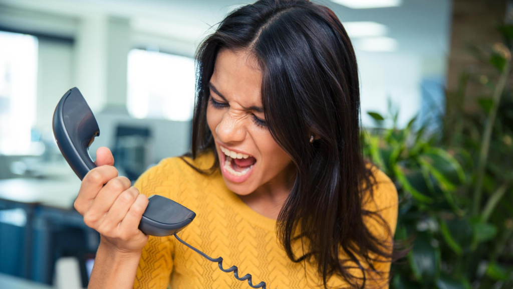 A customer having a discussion with her Hosted PBX Provider on Phone