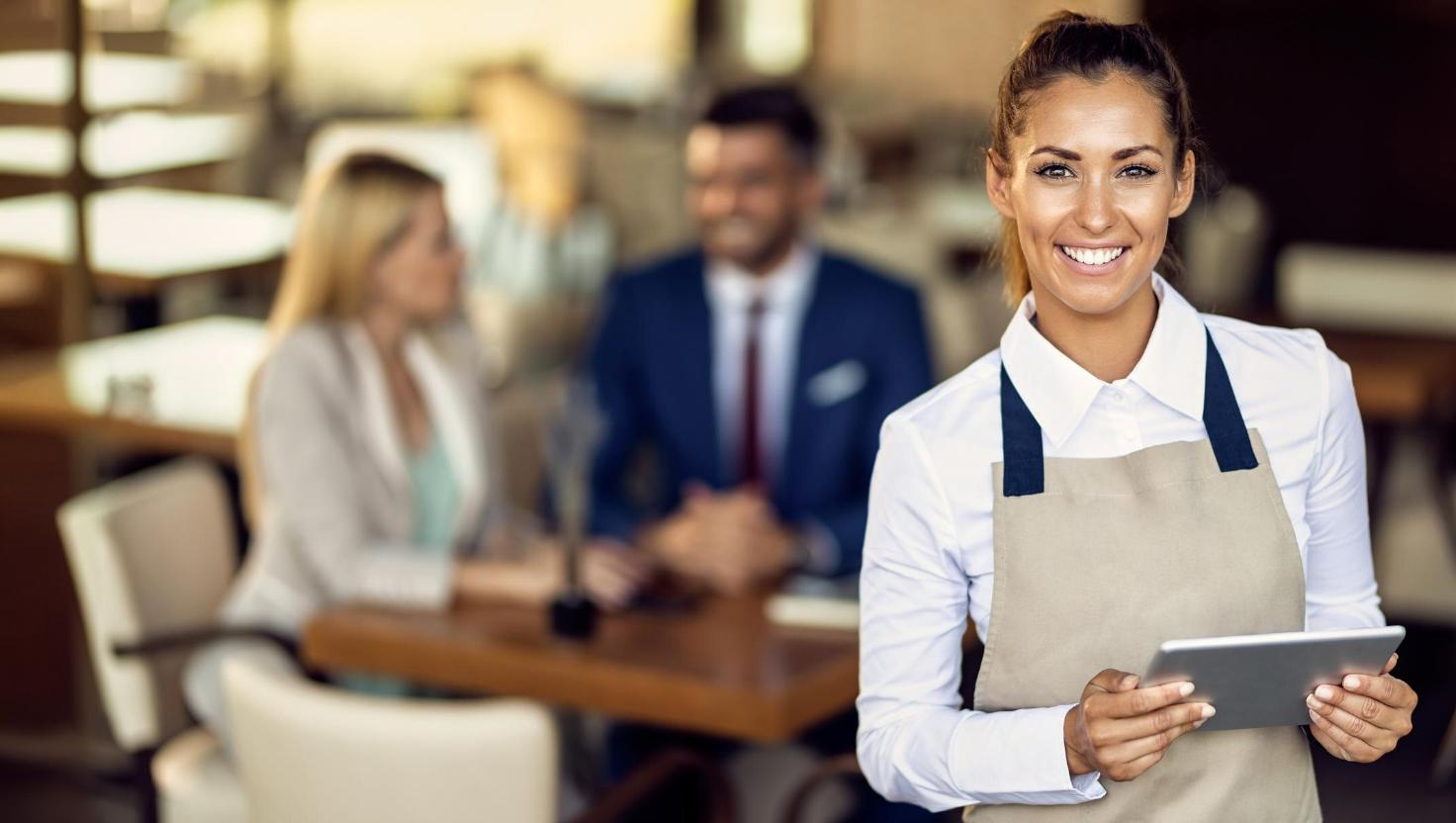 Happy waitress suing Hospitality communication solutions
