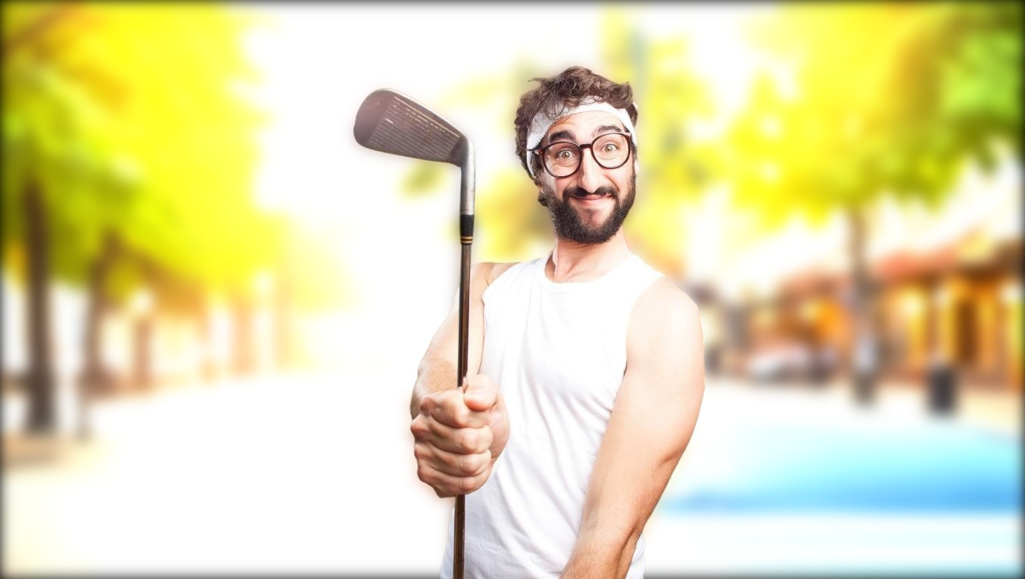 A man holding a golf club looking happy