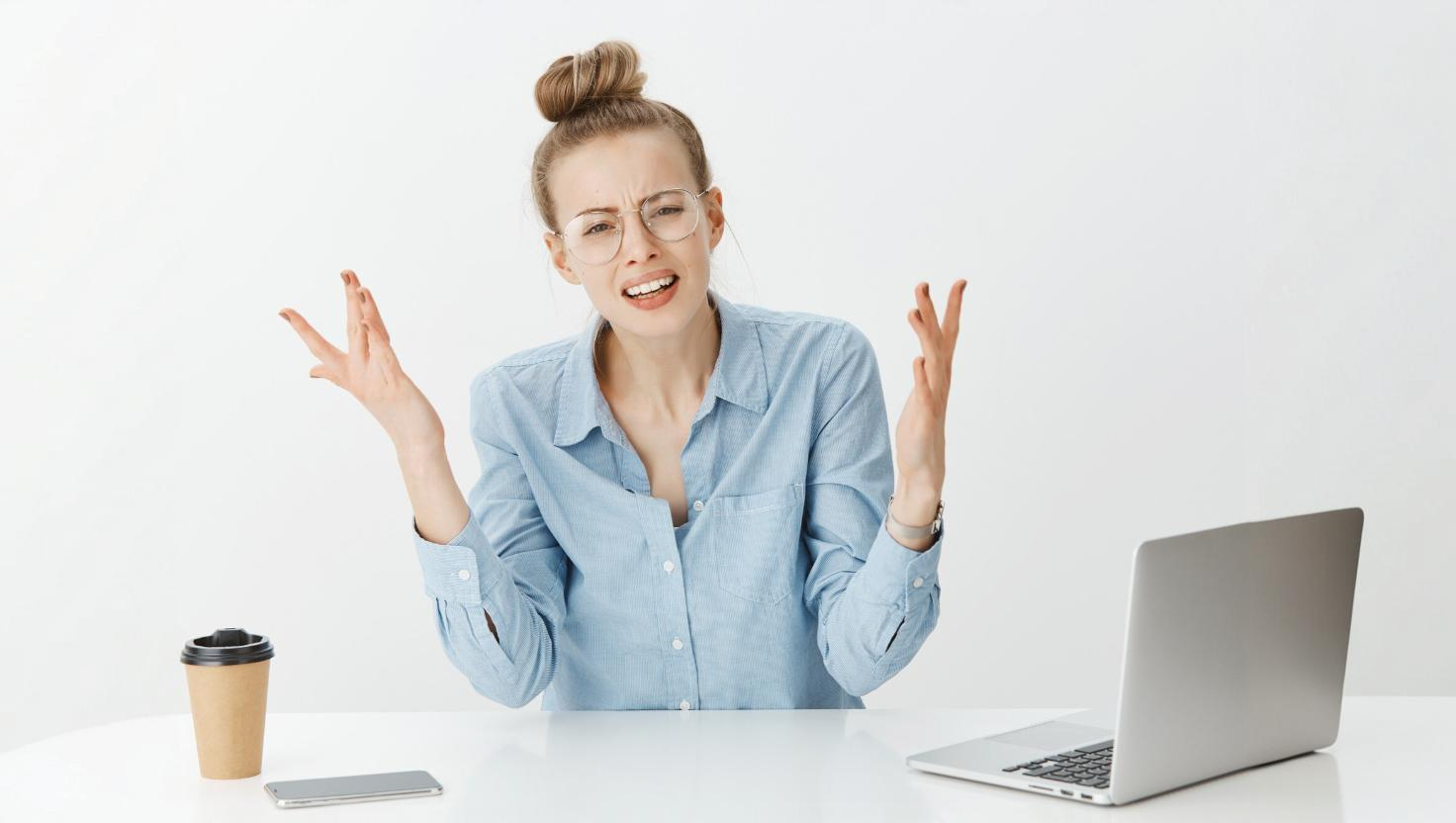 Frustrated customer with hands up conveying many contact center's lack of efficient contact center platforms