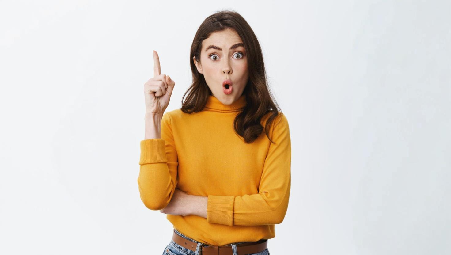 Woman pointing up, showing excitement at Contact Hub as answer to inefficient multichannel contact centers