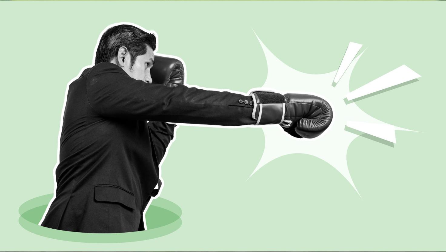 Businessman with boxing gloves punching–knock out punch to bad customer service 