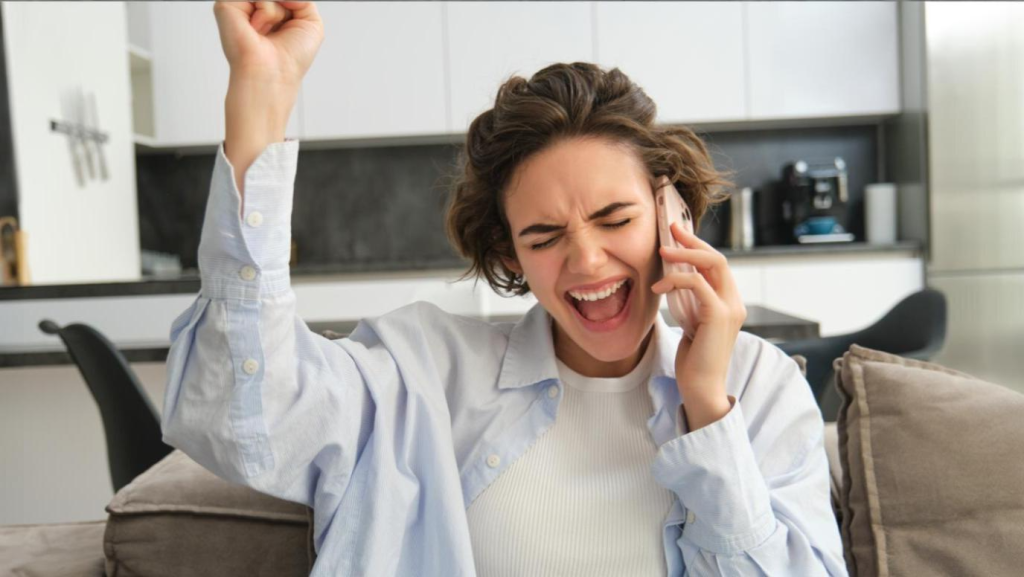 Woman excited about guest experience and ease of hotel front desk phone system and exceptional service.