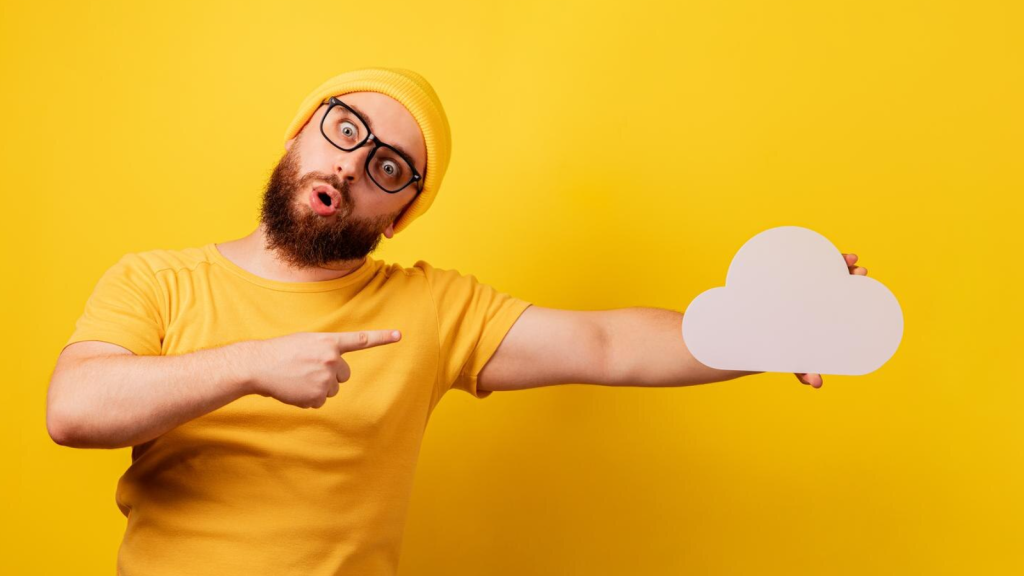 Man pointing at cloud in his other hand. Conveys choosing the best cloud phone system for small business success.